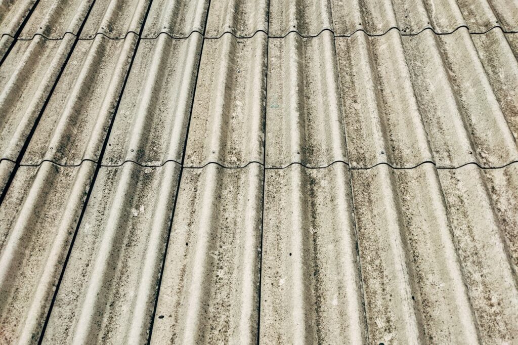 Detailed close-up of a corrugated concrete roof showcasing texture and pattern.