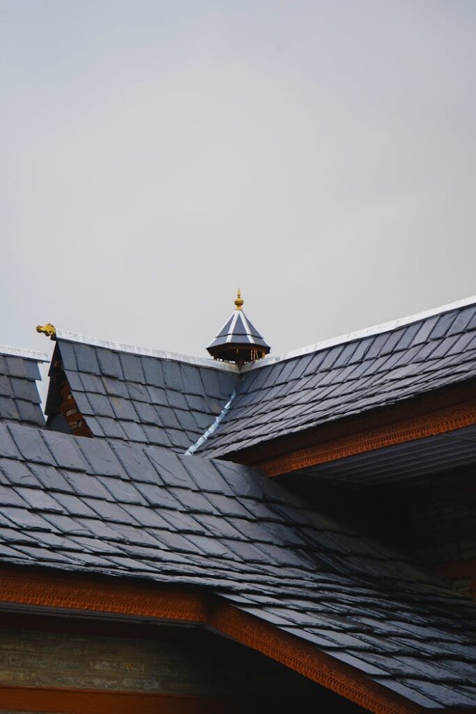 Close-up of a traditional architectural roof showcasing detailed shingles and ornamentation.